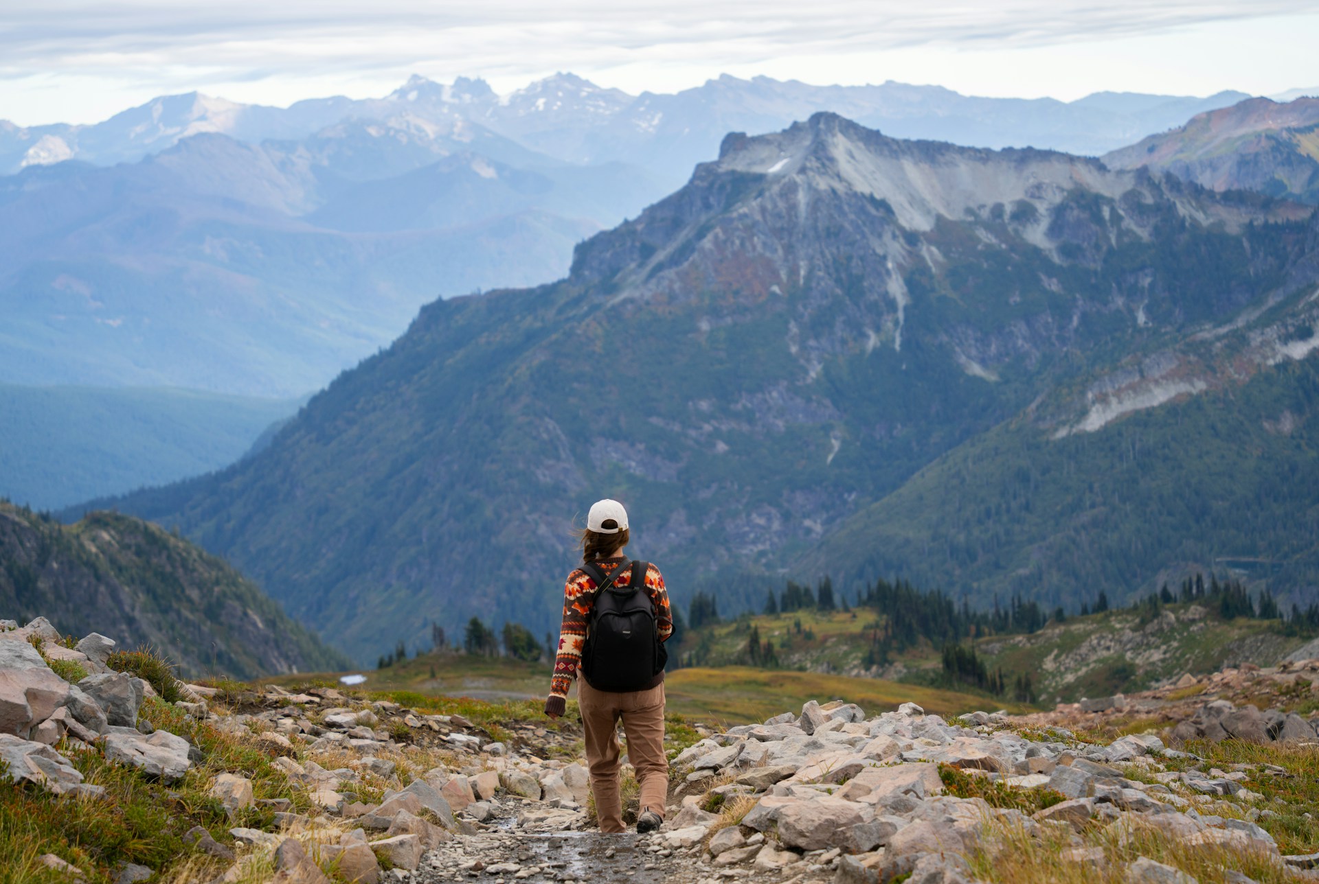 Woman hiking alone in a trail